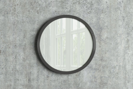 Dark wooden round frame poster mock up on the concrete wall. Front view. 3d illustrationの写真素材