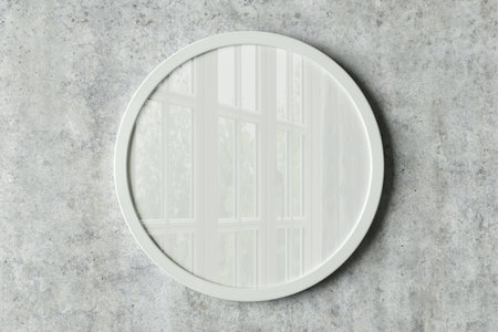 White round frame poster mock up on the concrete wall. Front view. 3d illustrationの写真素材