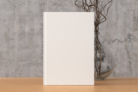 Vertical book cover mock up standing on a wooden desk with concrete wall background. 3d illustrationの写真素材