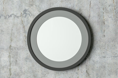 Dark wooden round frame poster mock up on the concrete wall. Front view. 3d illustrationの写真素材