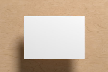 A sheet of paper mock up floating above the wooden table table. 3d illustrationの写真素材