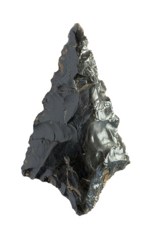 Neolithic obsidian arrowhead on white backgroundの写真素材