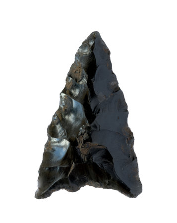 Neolithic obsidian arrowhead on white backgroundの写真素材