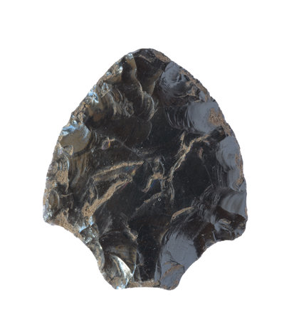 Neolithic obsidian arrowhead on white backgroundの写真素材