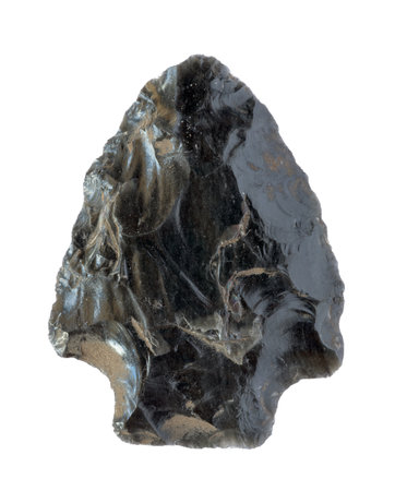 Neolithic obsidian arrowhead on white backgroundの写真素材