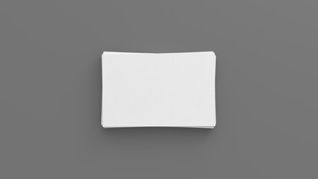 Business card mockup. Stack of business cards on gray background. View directly above. 3d illustrationの写真素材