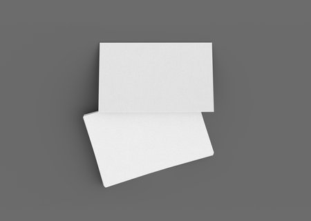 Business card mockup. Stack of business cards on gray background. View directly above. 3d illustrationの写真素材