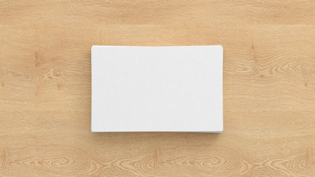 Business card mockup. Stack of business cards on wooden background. View directly above. 3d illustrationの写真素材