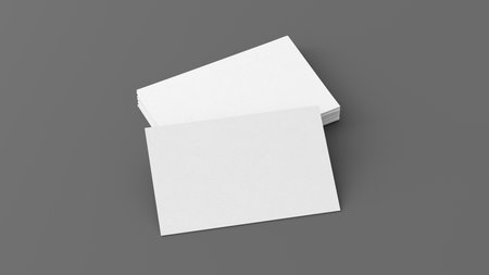 Business card mockup. Stack of business cards on gray background. Side view. 3d illustrationの写真素材
