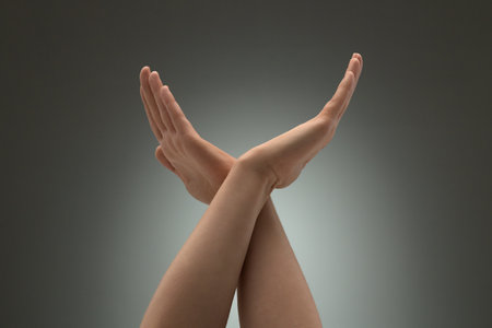 A gesture of prohibition or termination. Female palms crossedの写真素材