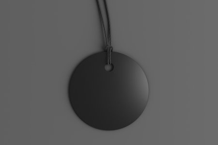Black round tag mockup on gray background. View directly above. 3d illustrationの写真素材