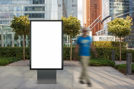 Blank street billboard poster stand mock up on city business district with skyscrapers on background. 3d illustration.の写真素材