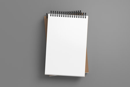 Notebook mockup. Two notebooks in a stack. Spiral notepad on gray background. 3d illustrationの写真素材
