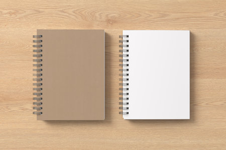 Notebook mockup. Closed and open blank notebook with craft paper cover. Spiral notepad on wooden background. 3d illustrationの写真素材