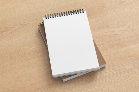 Notebook mockup. Two notebooks in a stack. Spiral notepad on wooden background. 3d illustrationの写真素材