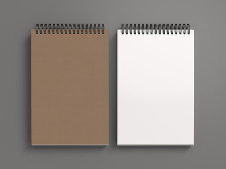 Notebook mockup. Closed and open blank notebook brown paper cover. Spiral notepad on gray background. 3d illustrationの写真素材