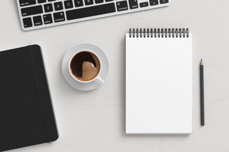 Notebook mockup. Blank workplace notebook. Spiral notepad on white wooden desk. 3d illustrationの写真素材