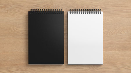 Notebook mockup. Closed and open blank notebook with black cover. Spiral notepad on wooden background. 3d illustrationの写真素材
