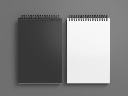 Notebook mockup. Closed and open blank notebook with black cover. Spiral notepad on gray background. 3d illustrationの写真素材