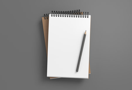 Notebook mockup. Two notebooks in a stack and pencil. Spiral notepad on gray background. 3d illustrationの写真素材