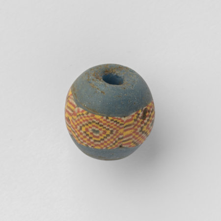 Ancient roman glass bead with mosaic beltの写真素材