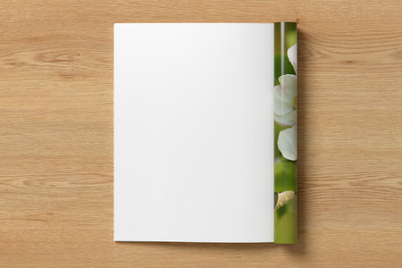 Magazine left-hand page mockup on wooden background. 3d illustrationの写真素材