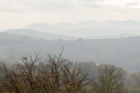 Misty hills and mountains. Spurs of the Apennine Mountains near Bologna, Emilia-Romagna, Italyの写真素材