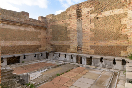 Ancient public toulet in Ostia Antica - ancient roman city and port. Rome, Latium, Italyのeditorial素材
