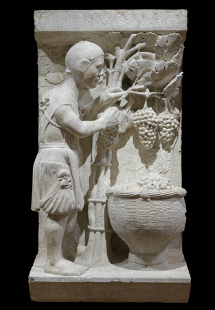 Grape harvest (September) - sculpture from Ferrara cathedral by Maestro dei Mesi. Italyのeditorial素材