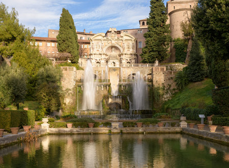 Villa d'Este, Tivoli, Italy. The Fountain of Neptune and The Fountain of the Organ with its Castellum aqua, or water castle across the fish pondsの写真素材