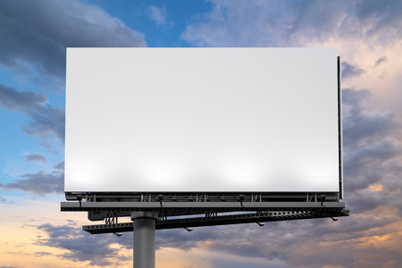 Mockup of a outdoor billboard against the evening sky. 3d illustrationの写真素材