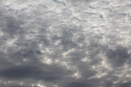White clouds in gray sky