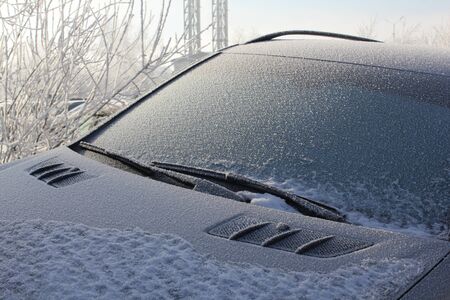 Frozen and snow-covered black car glass 30397の写真素材