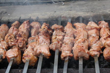 Meat porkis fried on the grill skewers at the coals 20459の写真素材