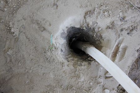 Top view of a water well with a plastic pipeの写真素材