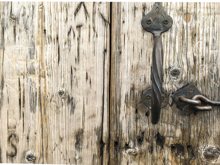 Closed old vintage wood door with door lockの写真素材