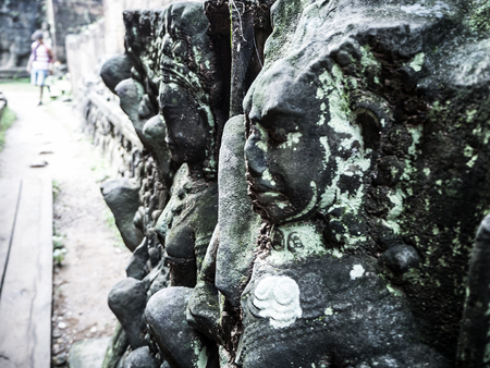 Detail of the wall of the ancient Angkor Thom Bayon Temple in the Angkor Area, near Siem Reap,...