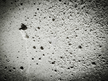 Cracked texture of cement close up. Smooth plastered stone Grey, Polished toned wall, painted, Copy space for you design and text.の写真素材