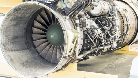 Opened Engine of modern  military fighter airplane. Rotating fan and turbine blades. Close-up front view.の写真素材