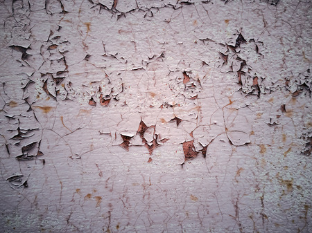 Close-up detail of cracked paint on rusty metal wall. Cracked painted old metal texture. Turquoise...