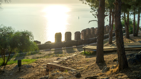 The wall of an ancient fortress in Alanya city, Turkey. Very Beautiful summer landscape with sea view at sunset. Summer concept. Vacation.の写真素材