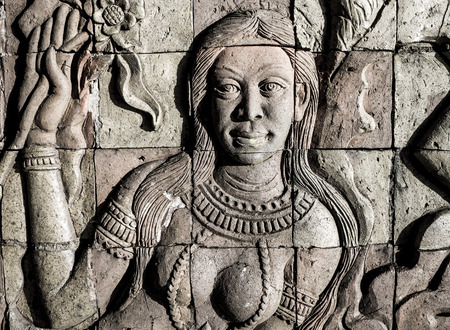 Wall of a temple enshrine Buddha relics, and are covered in wooden carvings depicting the...