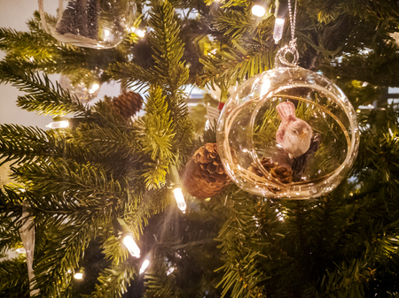 Christmas tree toys with blurred, sparkling, fairy background. Fir tree decoration. modern office interior. Lights, bokeh. festive. Merry Christmas concept. Copy space  for design or text boxの写真素材