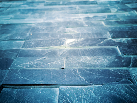 Marble brick stone tile wall texture background in light blue color. Grey stone tile wall pattern. Ceramic glass tiles composition pattern background -の写真素材