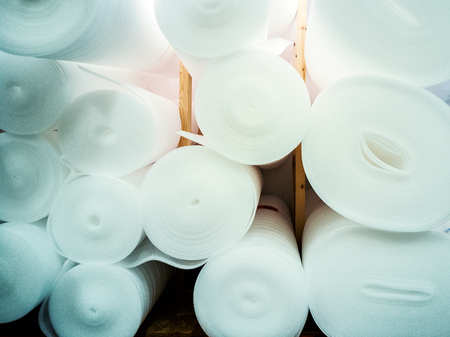 Rolls on the store shelf. Underlayment for laminate flooring installation. hin foam pad, often made of polyethylene or polypropylene, which is laid on the sub-floor before installing the laminateの写真素材