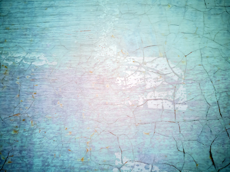 Close-up detail of cracked paint on rusty metal wall. Cracked painted old metal texture. Turquoise color. Rusted surface. Copy space for your text.の写真素材
