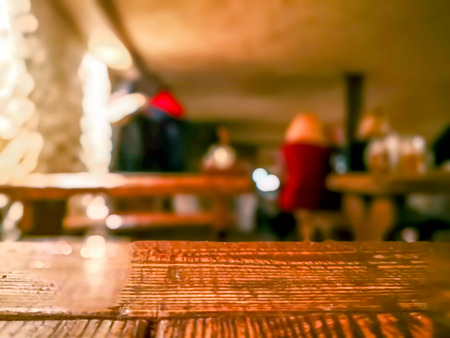 image of wooden table in front of abstract blurred background of resturant. Table top Counter Blur...
