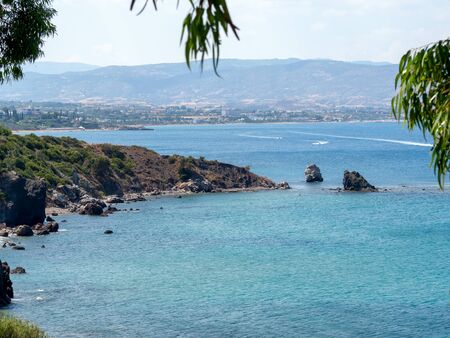 The beach of Aphrodite is the famous tourist destination, Cyprus. Amazing Seascape with blue sea, cliffs and treesの写真素材