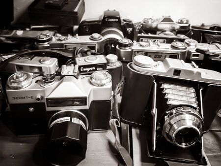 TALLINN, ESTONIA- DETCEMBER 07. 2019: Many old retro cameras For sale. Collection of antique vintage...