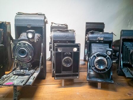 TALLINN, ESTONIA- DETCEMBER 07. 2019: Many old retro cameras For sale. Collection of antique vintage retro film analog cameras in a shopのeditorial素材